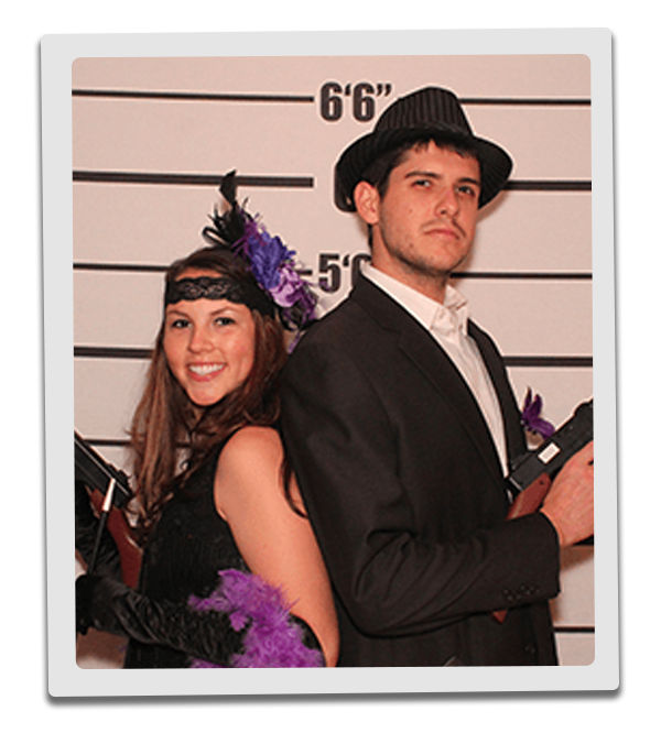 Baltimore Murder Mystery party guests pose for mugshots