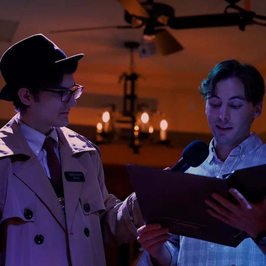 Professional actors performing at a Baltimore murder mystery